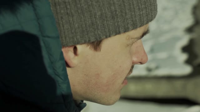 Man Takes Pictures On A Smartphone Close-up Face