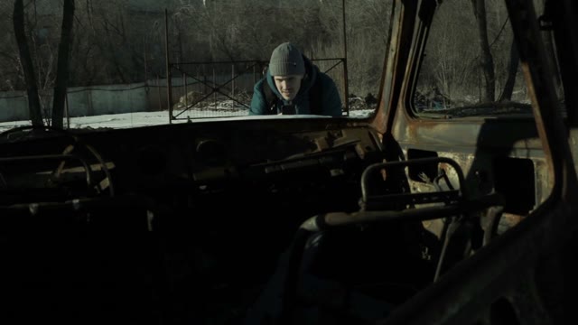 Man Takes Pictures Rusty Car Body Inside View