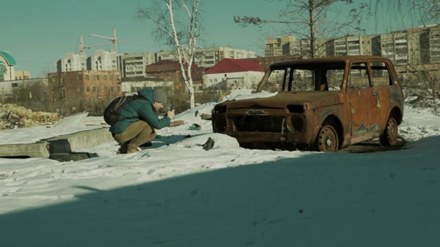 Man Takes Pictures Rusty Abandoned Car