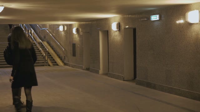 Man Standing With A Smartphone In The Underpass