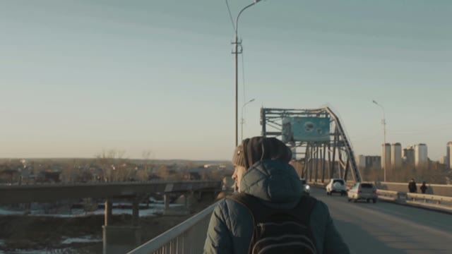 Man Walking On The Bridge