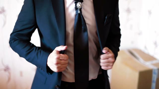 Man Adjusts His Jacket