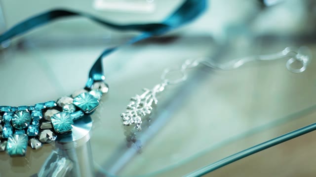 Necklace On A Transparent Table Close-up