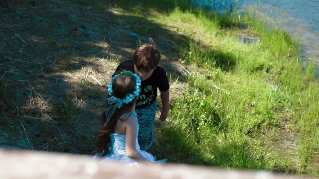 Boy And Girl Standing On The Shore
