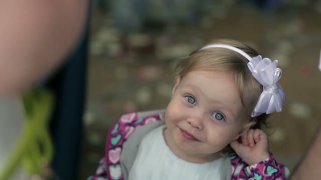 Little Girl With A Rim On The Head