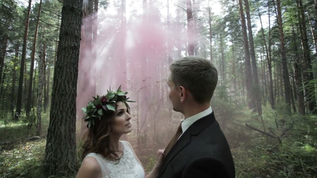 Newly Married Hugging In The Forest
