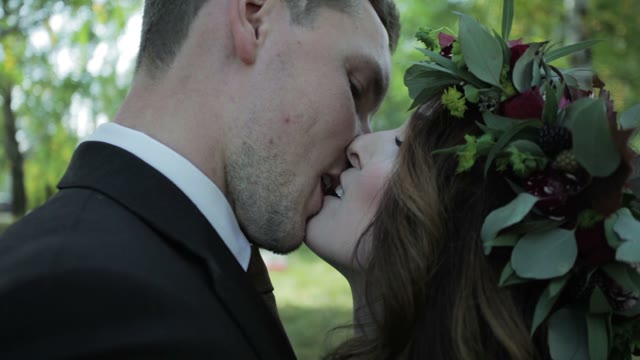 Newlyweds Kissing Outdoors Close-up