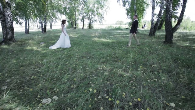 Newlyweds Joined Hands In A Grove
