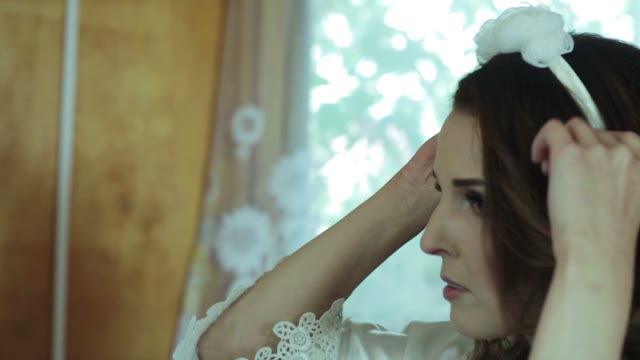 Woman Adjusts Her Hair Close-up