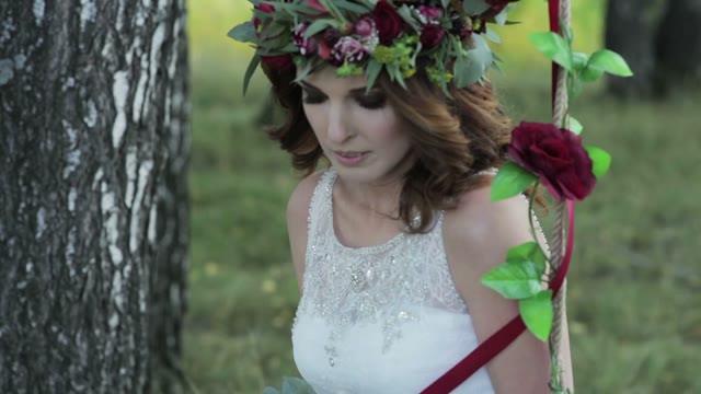 Bride Sitting On A Swing Close-up