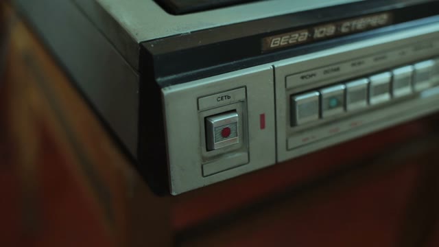 Female Pressing A Button On The Turntable Close-up
