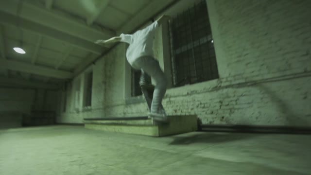 Man Makes A Trick On A Skateboard