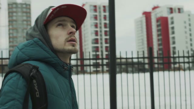 Young Boy Walks Through The City