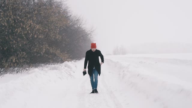 The Guy Running Through The Snow. Slow Motion