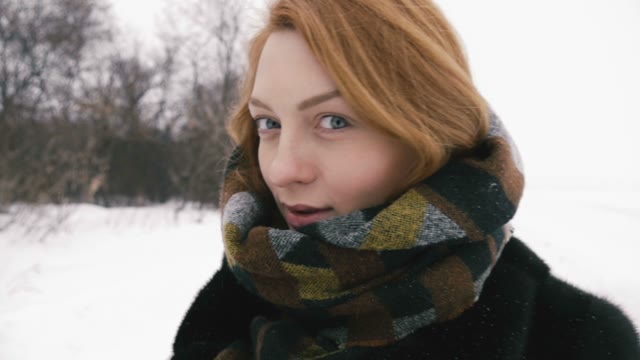 Beautiful Girl Looking At The Camera. Slow Motion