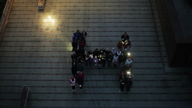 Crowd Standing In The Form Of Letters