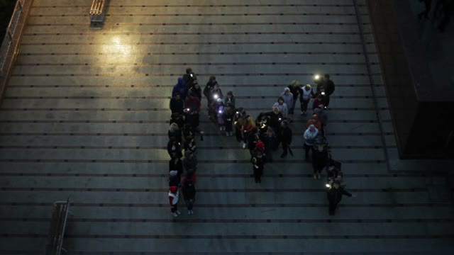 Crowd Standing In The Form Of Letters