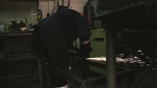 A Man Working With A Power Saw