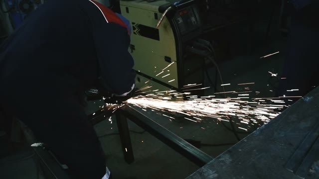 A Man Working With A Electric Saw