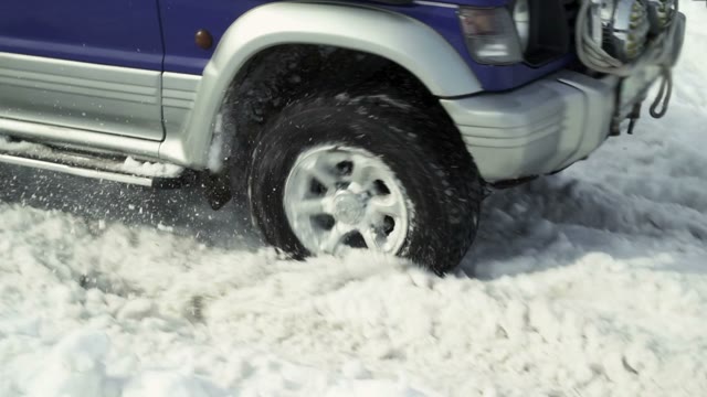 SUV Rides On The Road In The Winter Forest