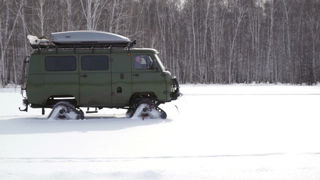 Snowmobile Rides In The Winter Forest