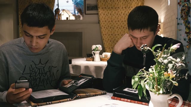 The Guys In The Restaurant Choosing What To Order