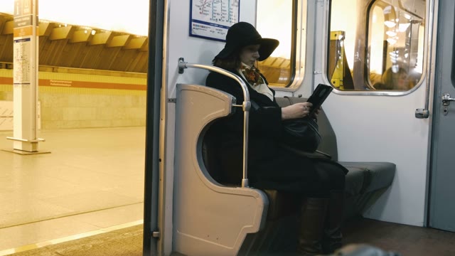 The Girl In The Subway Reading A Book