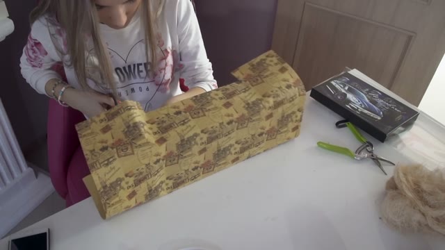 Cute Girl Makes A Nice Package For Gift