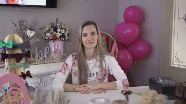 Beautiful Girl Sitting At A Table Laughing