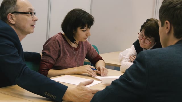 Several People Are Talking At The Table