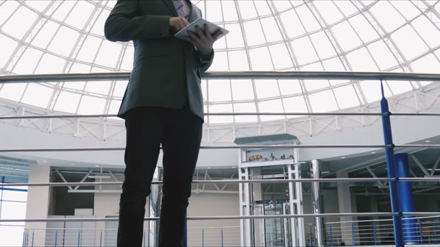 Businessman Working With Tablet In The Mall