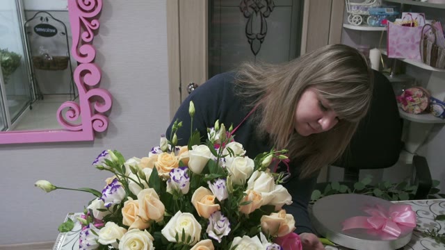 Florists Create Bouquets In Flower Shop