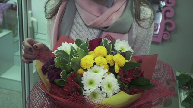 Florist Demonstrates Complete Bouquet Of Flowers