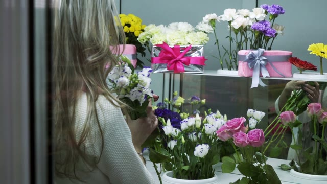 Florists Create Bouquets In Flower Shop