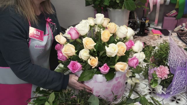 Florists Create Bouquets In Flower Shop