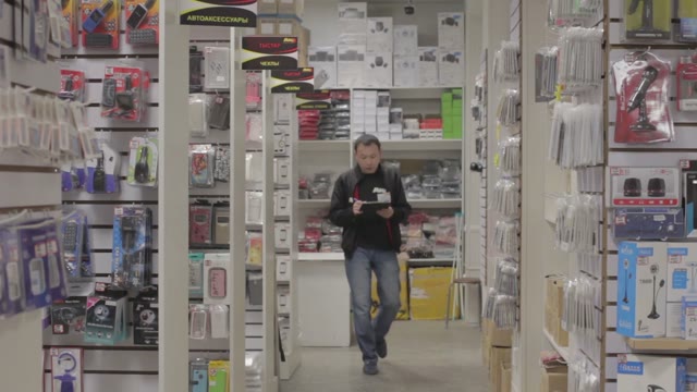 Man Holds An Inventory Of Equipment In The Shop