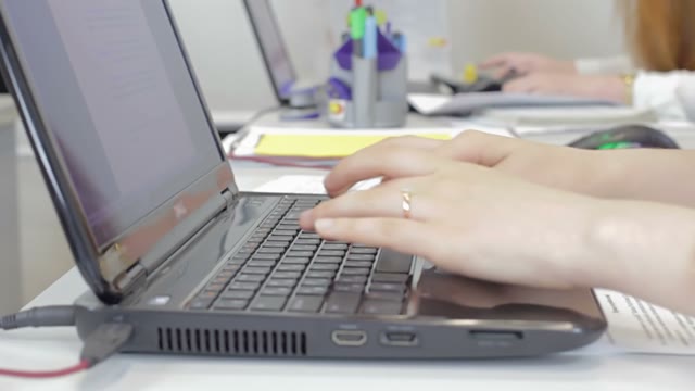 Office Workers Make Out Documents On A Computer