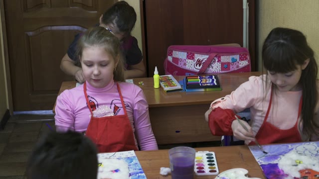 Small Children On Creative Lesson In Primary Class