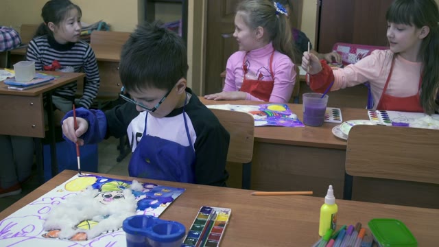 Small Children On Creative Lesson In Primary Class