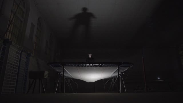 Man Jumping On The Trampoline In The Sports Class