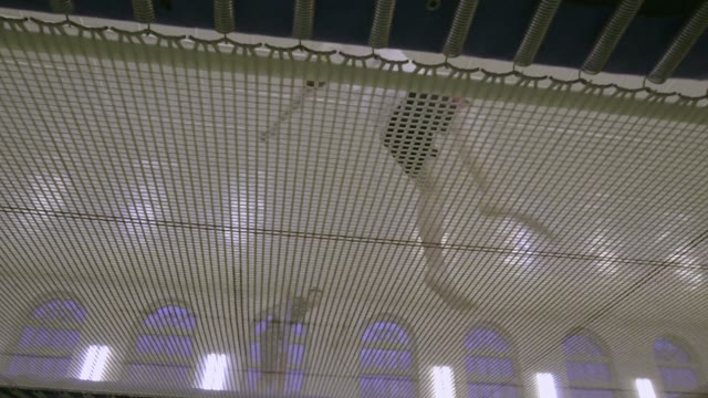 Man Jumping On The Trampoline In The Sports Class