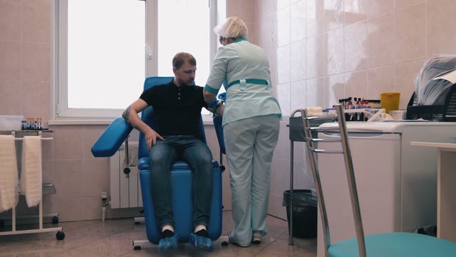 Man Donates Blood In The Doctor's Office