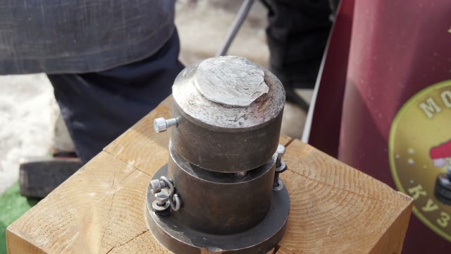 Smith Mints Coins In The Old Device