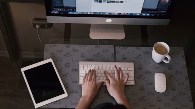 Pretty Girl Works On The Computer And A Tablet