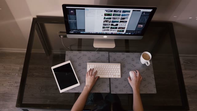 Pretty Girl Works On The Computer And A Tablet