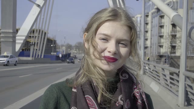 Cute Curly Girl Walking Through The City