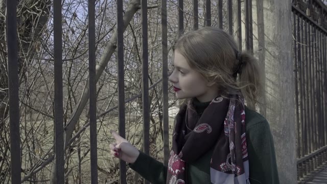 Cute Curly Girl Walking Through The Park