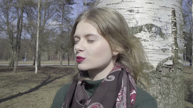 Cute Curly Girl Walking Through The Park
