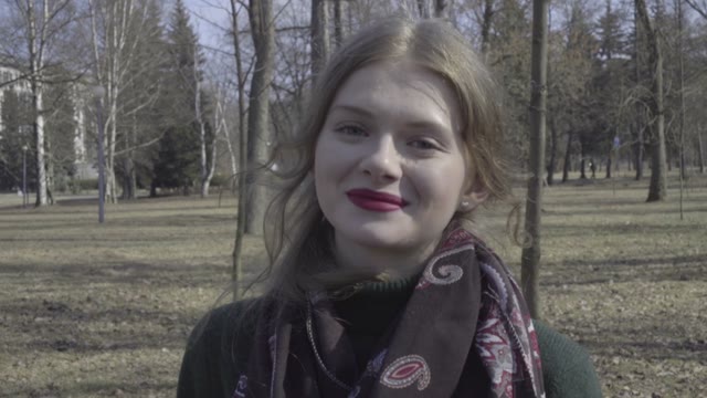 Cute Curly Girl Walking Through The Park