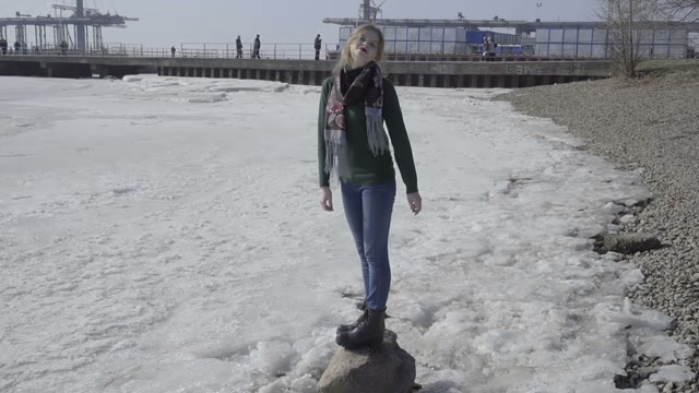 Cute Curly Girl Walking On The River Shore